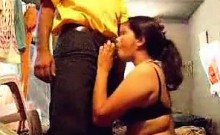 Bhabhi unzips her husband's pants, kneels in front of him