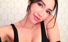 Busty babe playing with her big boobs